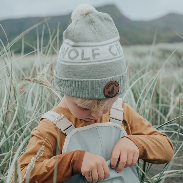 Child outside wearing the CRYWOLF Alpine Beanie - Moss detail view