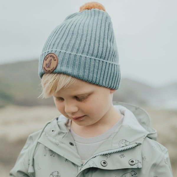 Child wearing the CRYWOLF Pom Pom Beanie - Scout Blue side view