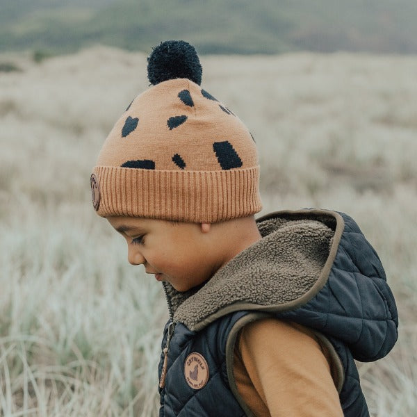 Child wearing the CRYWOLF Pom Pom Beanie - Stones side view
