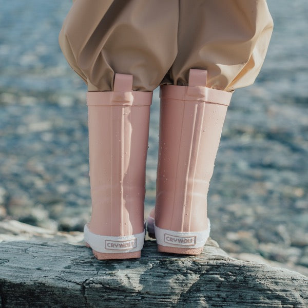 Child wearing the CRYWOLF Rain Boots Blush back view