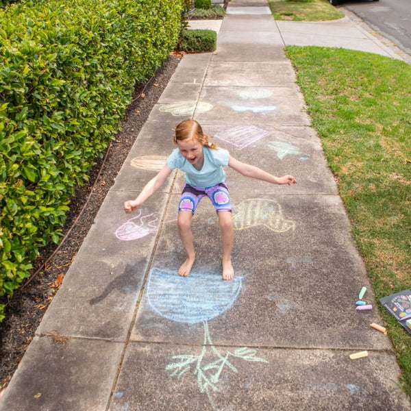 Child playing with the TIGER TRIBE Chalk It Up - Games For Outdoors