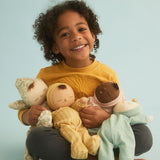 Child holding the OLLI ELLA Daydream Dozy dolls
