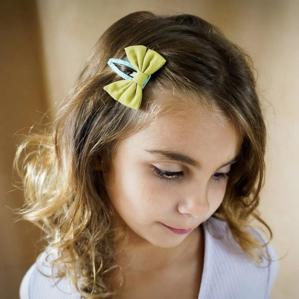 Girl wearing the GRECH & CO Fable Bow Clip Chartreuse 