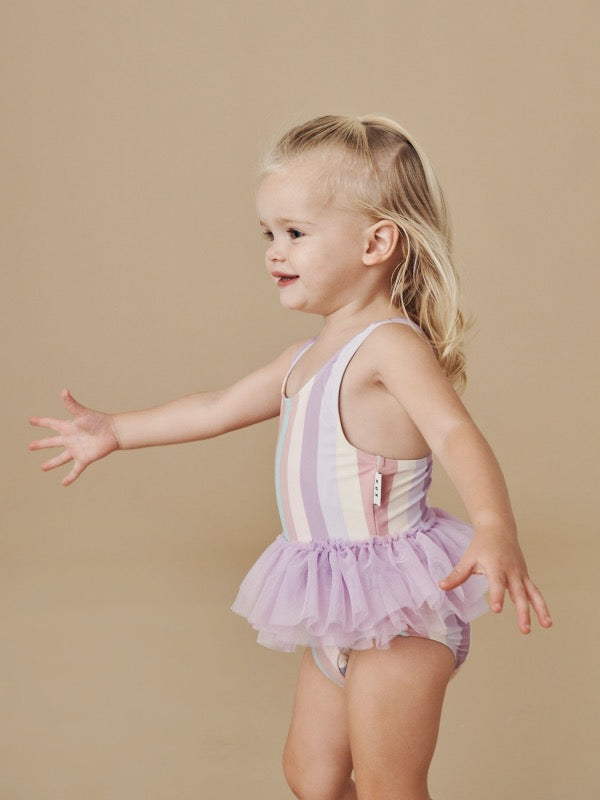 Child wearing the HUXBABY Stripe Ballet Swimsuit side view