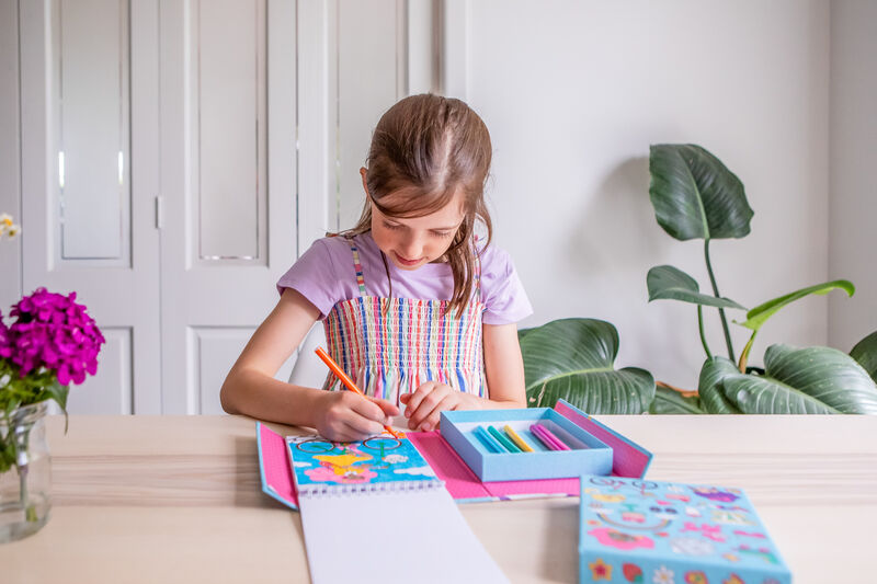 Child playing with the TIGER TRIBE Hidden Pattern Set - Pattern Party