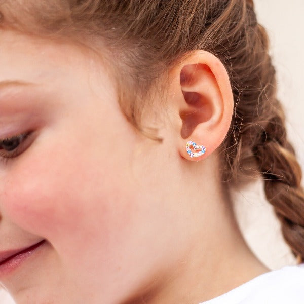 Girl wearing LAUREN HINKLEY Gem Heart Earrings