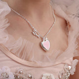 Girl wearing the LAUREN HINKLEY Love Heart Locket Necklace