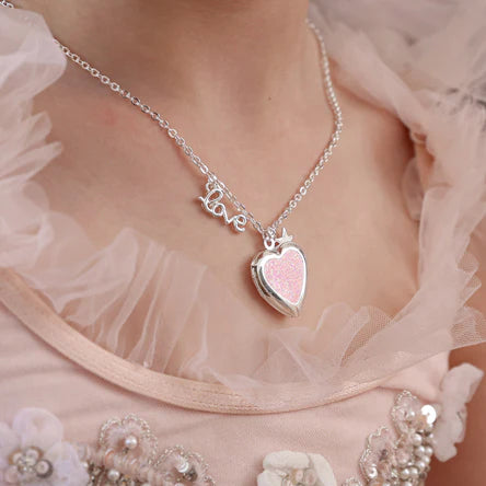 Girl wearing the LAUREN HINKLEY Love Heart Locket Necklace