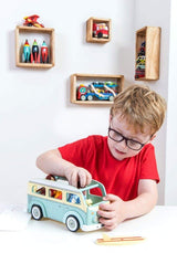 Boy playing with LE TOY VAN Holiday Campervan