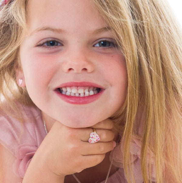 Girl wearing LAUREN HINKLEY Petite Fleur Heart Ring