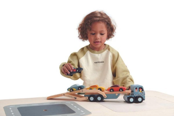 Child playing with TENDER LEAF Car Transporter