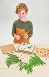 Child playing with the TENDER LEAF My Botanical Flower Press