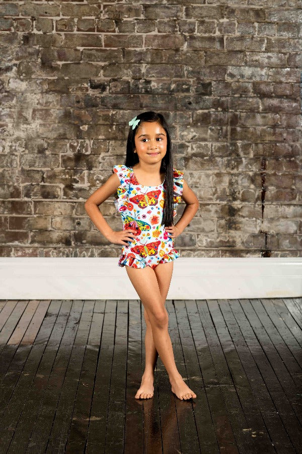 Girl wearing the ROCK YOUR BABY Butterflies One-Piece Swim with Full Lining