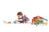 Child playing with the TENDER LEAF Farm and extra farm animals