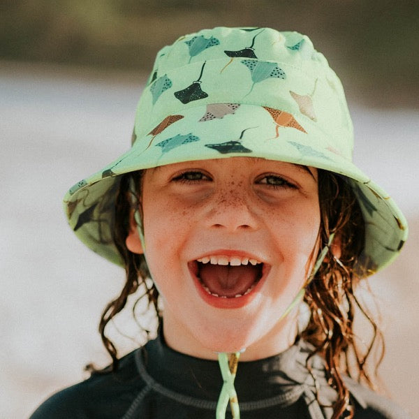 Child wearing the BEDHEAD HATS Kids Classic Swim Bucket Beach Hat - Rays 
