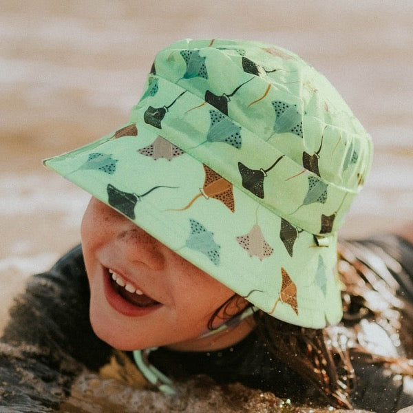 Child wearing the BEDHEAD HATS Kids Classic Swim Bucket Beach Hat - Rays top view