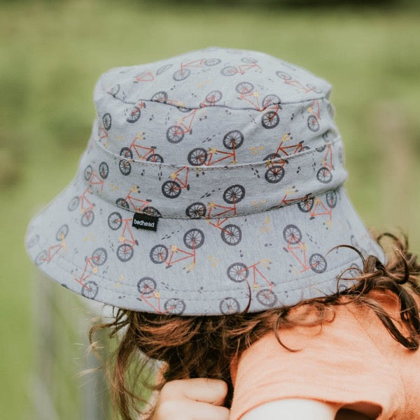 Child wearing the BEDHEAD HATS Kids Classic Bucket Sun Hat - Treadly side view