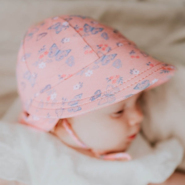 Baby wearing the BEDHEAD HATS Legionnaire Flap Sun Hat - Butterfly side view