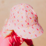 Child wearing the BEDHEAD HATS Kids Swim Legionnaire Beach Hat - Ice Pop top view