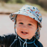 Baby wearing the BEDHEAD HATS Kids Swim Legionnaire Beach Hat - Surfboard 
