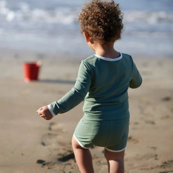 Child wearing NATURE BABY Olive Splash top & splash shorts - back view